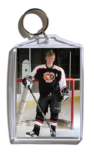 Keychain - 3x4 inch keychain that holds two wallet photos of your player.
